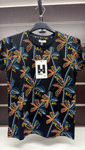 Camiseta niño Nath Kids negra con palmeras multicolor — fotografía del producto