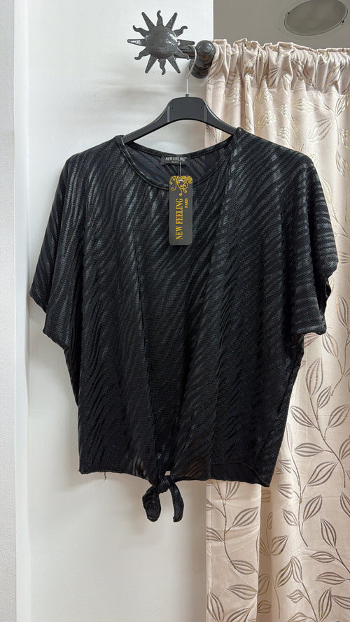 Blusa negra efecto cebra con nudo — fotografía del producto