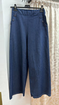 Pantalón ancho azul con botones laterales — fotografía del producto