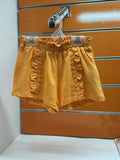 Short niña mostaza con volantes y bordado — fotografía del producto