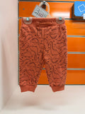 Pantalón bebé teja con dinosaurios, talla 6 meses