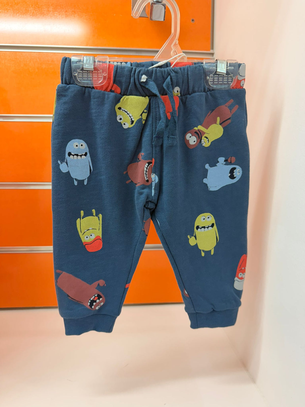 Pantalón bebé Losan azul con estampado de monstruos, talla 6-9 meses / 74 cm