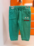 Pantalón bebé Losan verde con detalle de monstruo en bolsillo