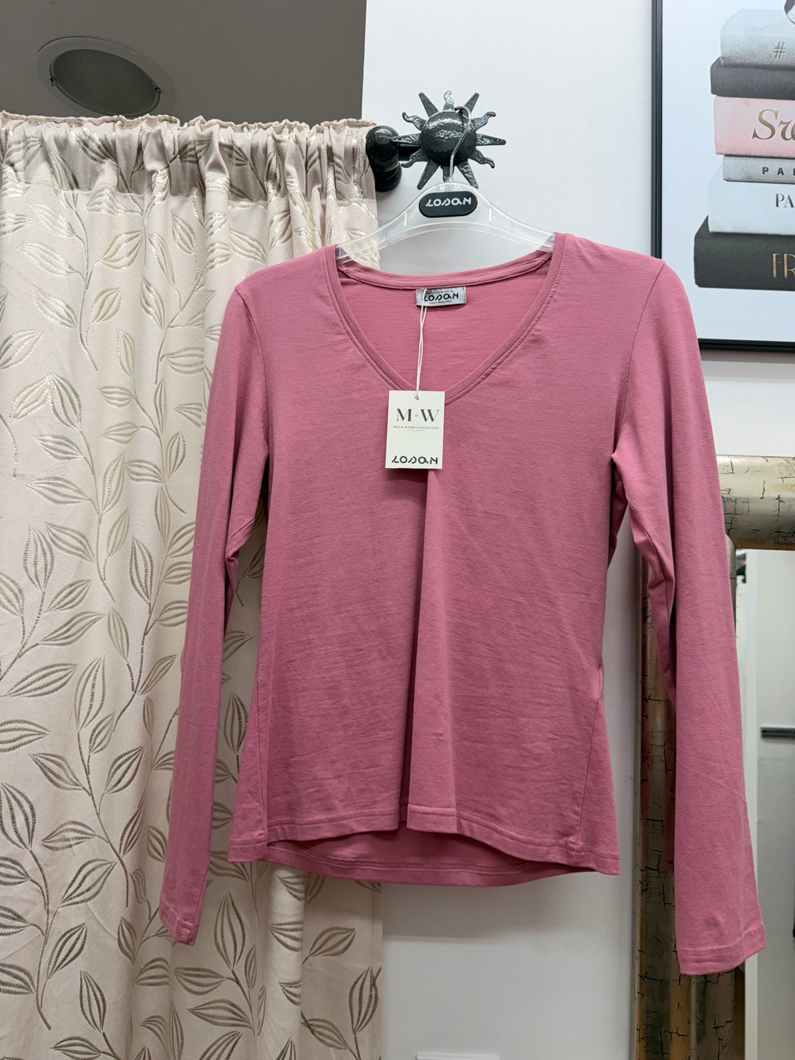 Top de mujer rosa de manga larga con volantes diagonales
