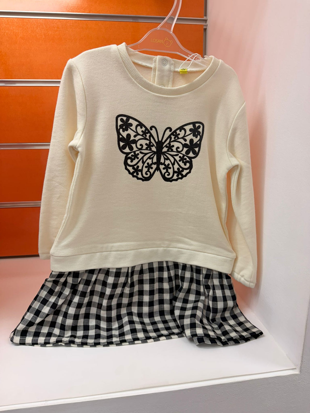 Vestido niña Losan crudo con mariposa negra y bajo de cuadros, 24-36 meses